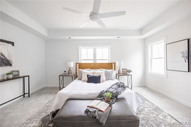 bedroom featuring carpet flooring, multiple windows, and baseboards