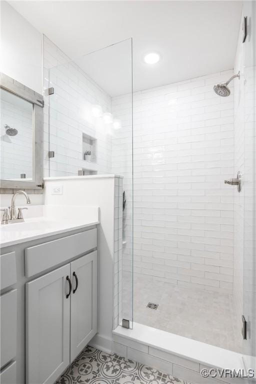 full bath featuring a shower stall and vanity