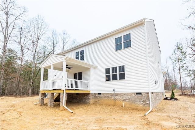 rear view of house with crawl space and ceiling fan