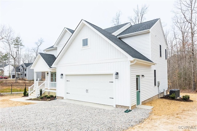 view of property exterior with a garage, gravel driveway, roof with shingles, and central AC