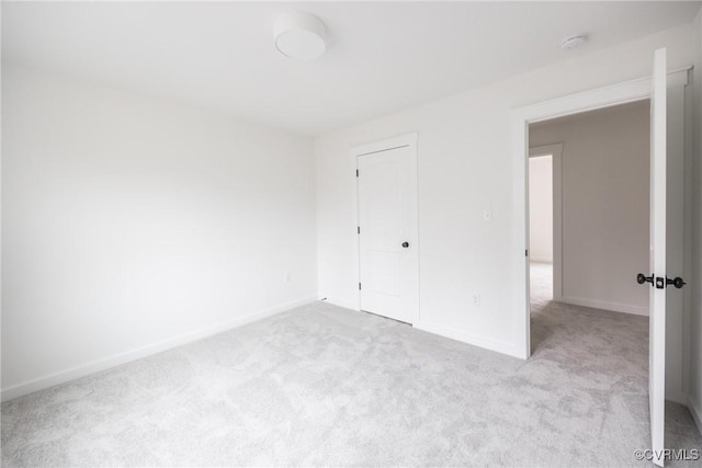 unfurnished bedroom featuring baseboards and carpet floors