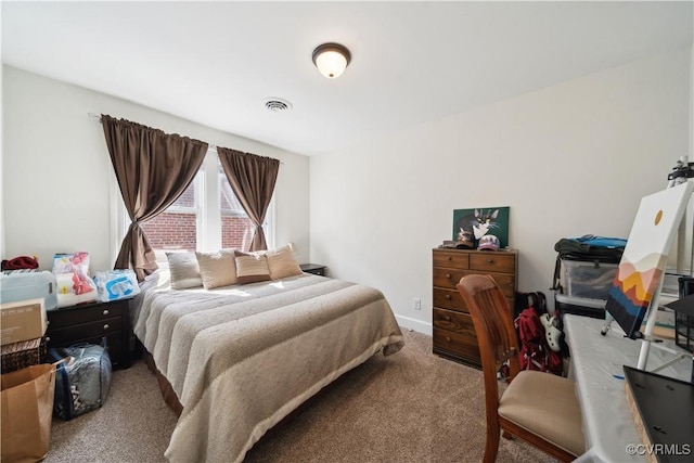 carpeted bedroom with baseboards and visible vents