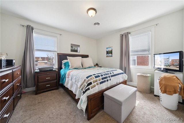 carpeted bedroom with visible vents