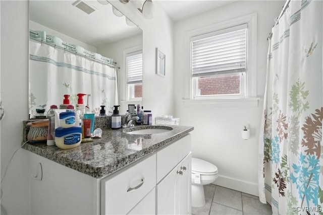 bathroom with tile patterned floors, visible vents, toilet, baseboards, and vanity