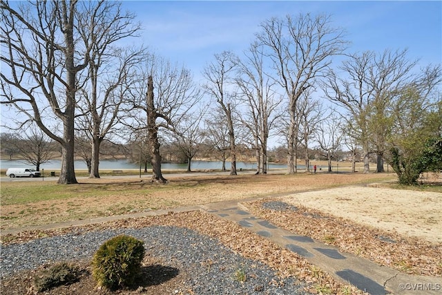 surrounding community with a water view