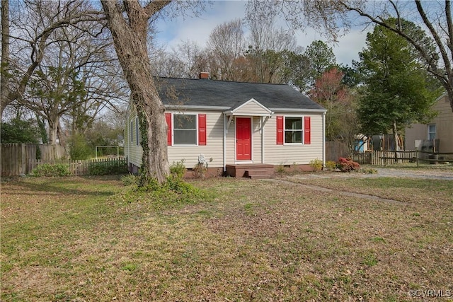 bungalow featuring a front yard, fence, a chimney, and crawl space