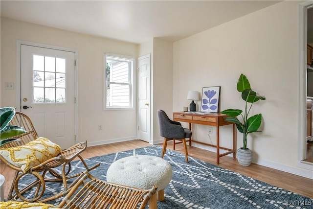 office featuring baseboards and wood finished floors