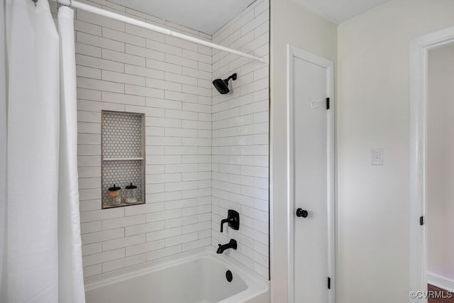 bathroom featuring shower / bathtub combination with curtain