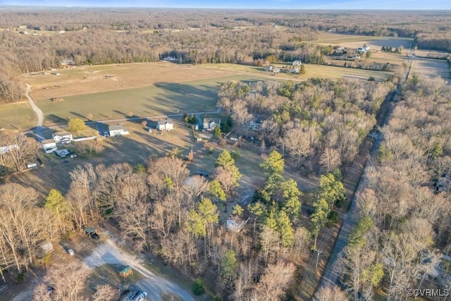 drone / aerial view with a rural view and a wooded view