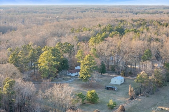 aerial view featuring a wooded view