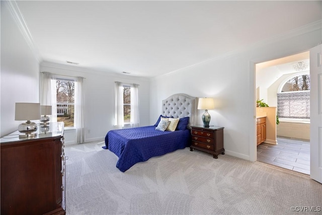 bedroom featuring carpet flooring, ensuite bath, baseboards, and ornamental molding