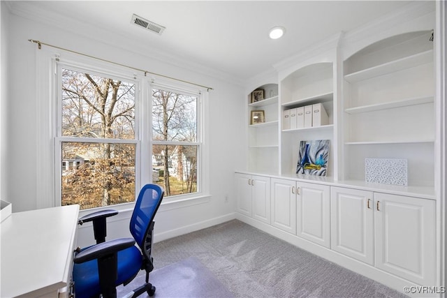 home office featuring light carpet, visible vents, baseboards, and ornamental molding