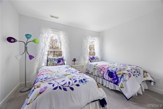 bedroom featuring baseboards, visible vents, multiple windows, and carpet floors