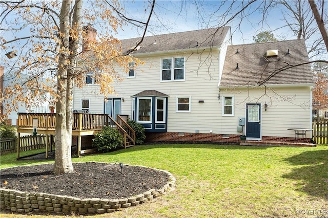 rear view of property featuring a wooden deck, a yard, fence, and a shingled roof