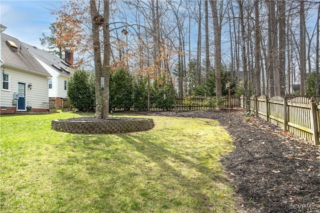 view of yard with central air condition unit and fence private yard