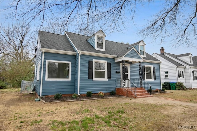 cape cod-style house with a shingled roof