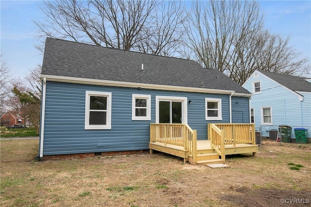 rear view of house featuring a shingled roof, crawl space, a yard, and a wooden deck