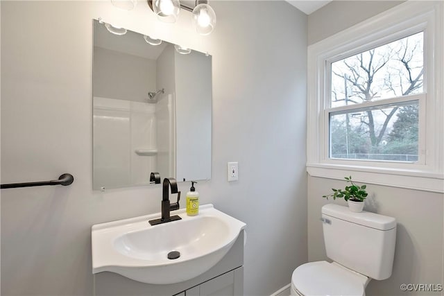 full bathroom featuring a shower, toilet, and vanity