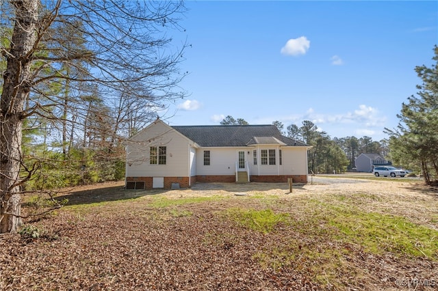 rear view of house featuring crawl space