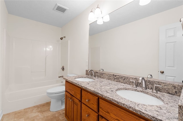 full bathroom with a sink, visible vents, toilet, and washtub / shower combination