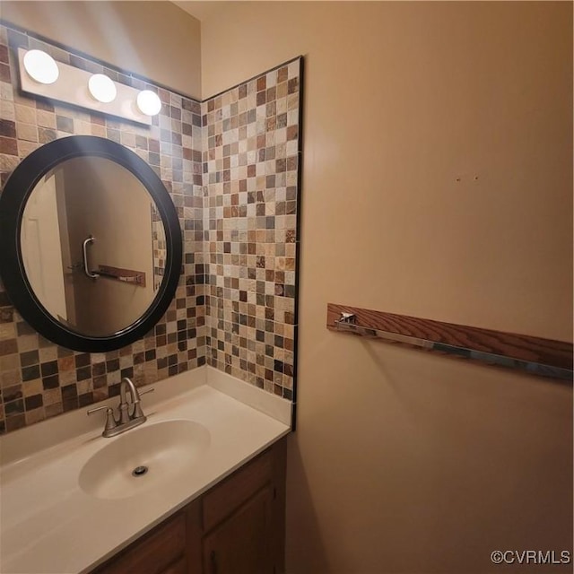 bathroom featuring decorative backsplash and vanity