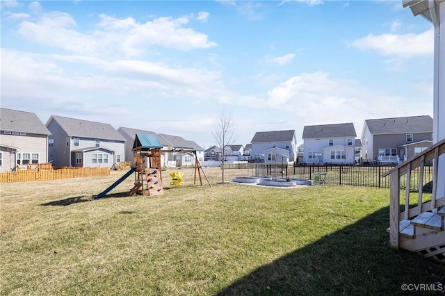 8160 Lyman Ct, Mechanicsville, VA 23116 - fenced backyard with a residential view and a playground