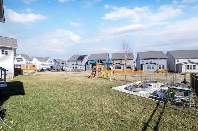 8160 Lyman Ct, Mechanicsville, VA 23116 - view of yard featuring a residential view, a playground, and a vegetable garden