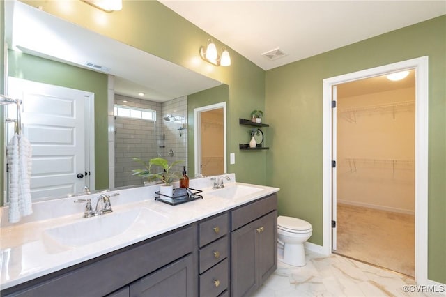 8160 Lyman Ct, Mechanicsville, VA 23116 - full bath with double vanity, tiled shower, a walk in closet, and marble finish floors
