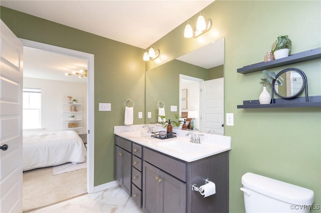 8160 Lyman Ct, Mechanicsville, VA 23116 - ensuite bathroom featuring double vanity and marble look tile flooring
