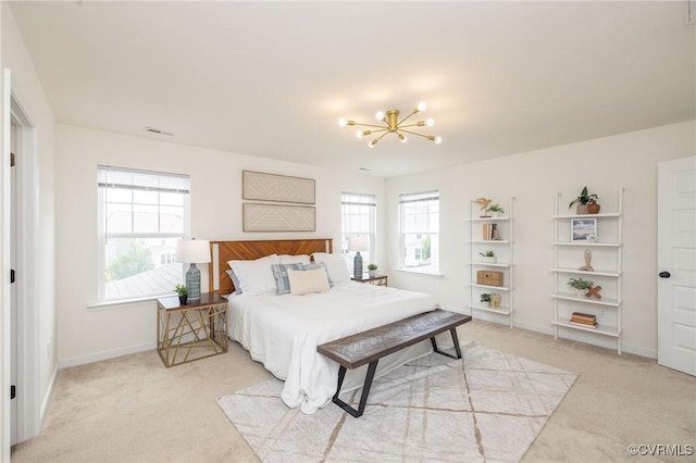 8160 Lyman Ct, Mechanicsville, VA 23116 - bedroom with light carpet and a chandelier