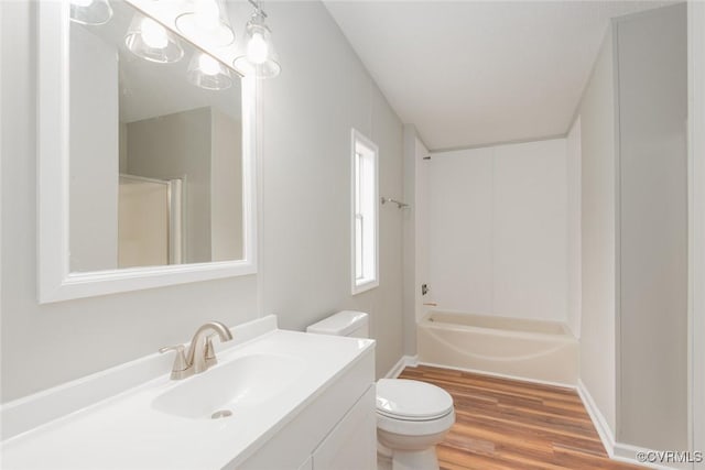 full bathroom featuring vanity,  shower combination, toilet, and wood finished floors