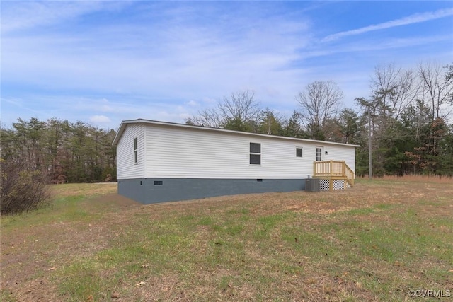 exterior space with a yard and crawl space