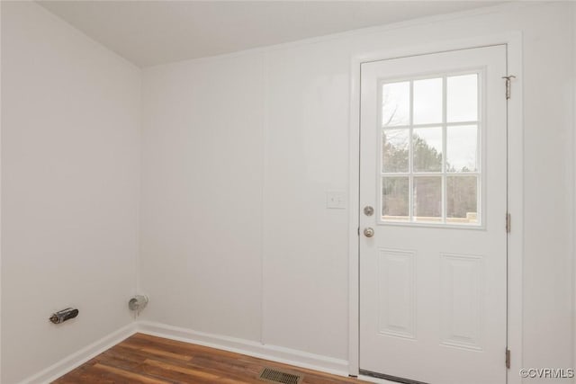 laundry room with visible vents, baseboards, and dark wood-style floors