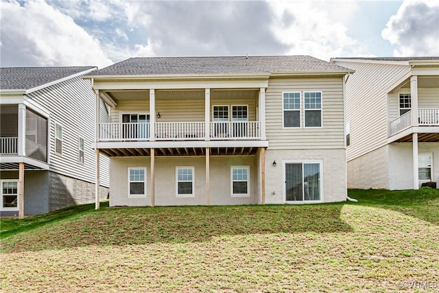 back of house with a lawn