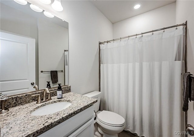 bathroom featuring recessed lighting, curtained shower, toilet, and vanity