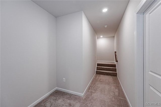 hallway featuring stairway, recessed lighting, baseboards, and carpet