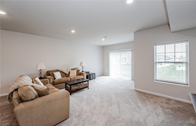 living room with recessed lighting, baseboards, and carpet floors