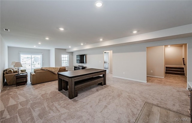 kitchen featuring visible vents, baseboards, open floor plan, light colored carpet, and recessed lighting