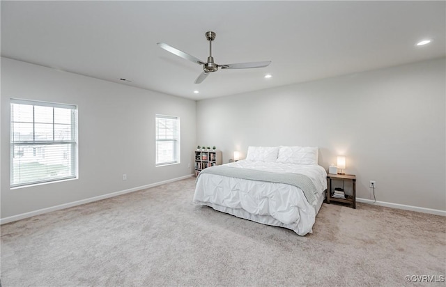 carpeted bedroom featuring recessed lighting, baseboards, and a ceiling fan