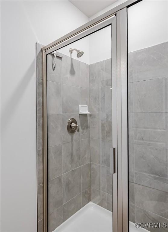 bathroom with a shower stall