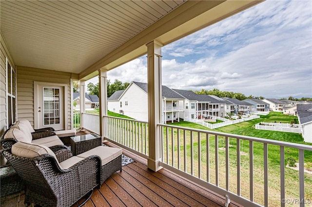 deck with a residential view and outdoor lounge area