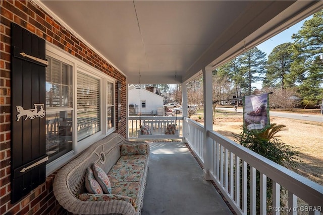 balcony featuring a porch