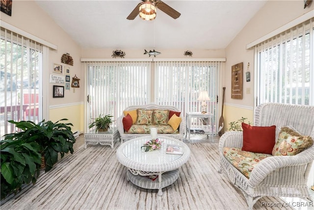 interior space with vaulted ceiling and ceiling fan