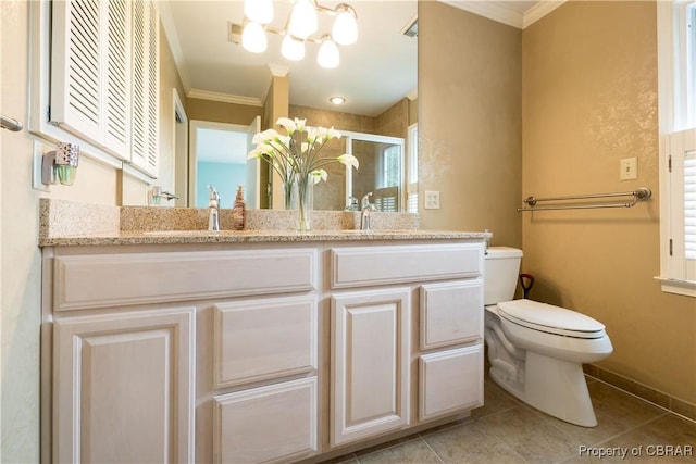 bathroom with tile patterned flooring, a shower stall, crown molding, toilet, and a sink