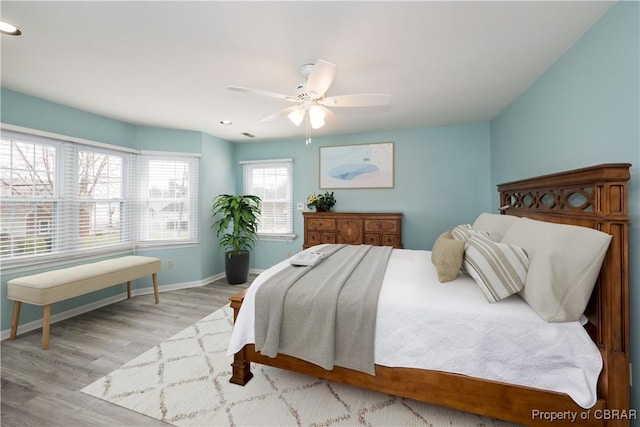 bedroom with recessed lighting, ceiling fan, baseboards, and wood finished floors