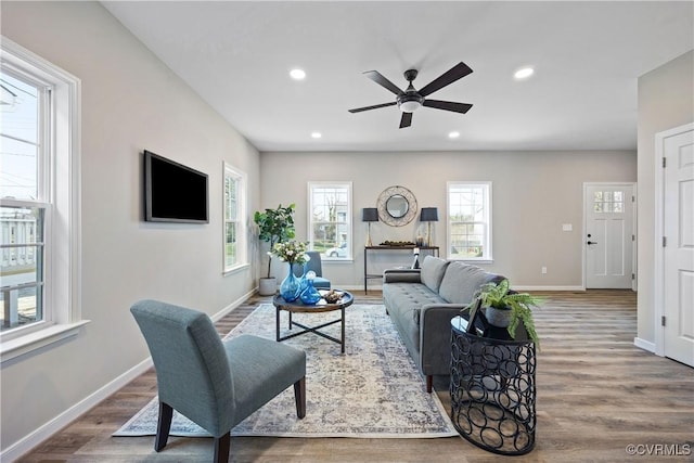 living area featuring recessed lighting, baseboards, a ceiling fan, and wood finished floors