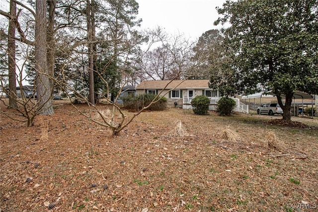 exterior space with a detached carport