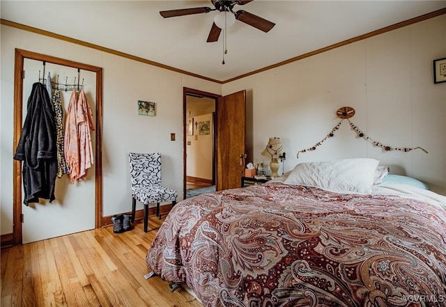 bedroom with a ceiling fan, baseboards, light wood finished floors, and ornamental molding