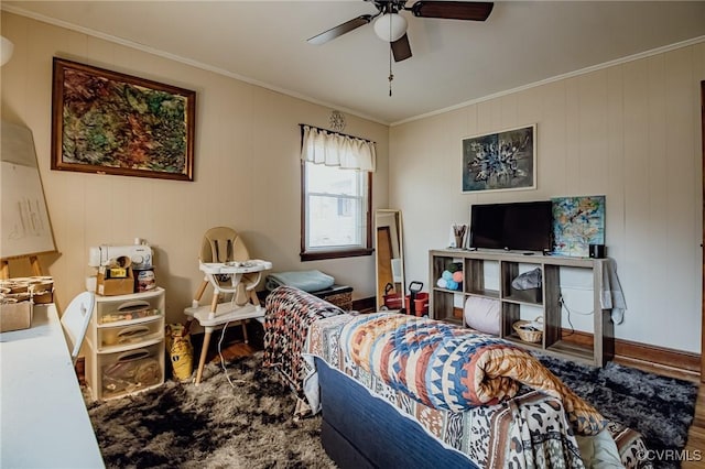 bedroom featuring wood finished floors, ceiling fan, and ornamental molding