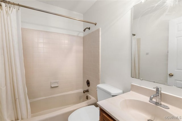 bathroom featuring vanity, toilet, and shower / bath combo with shower curtain